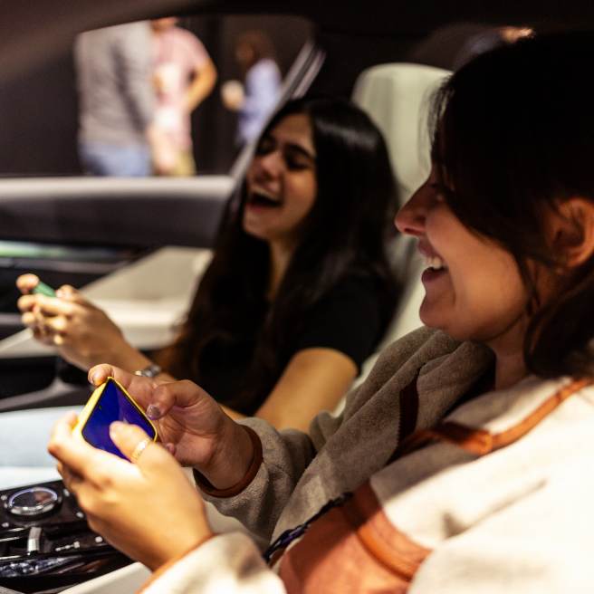 game booth ideas for successful gaming expo_2 girls playing game in the car